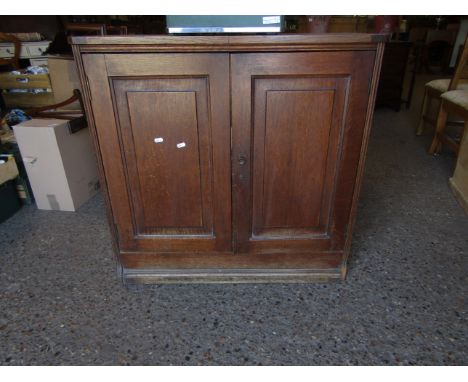 OAK FRAMED SIDE CUPBOARD WITH TWO PANELLED DOORS AND BUTTON HANDLE   