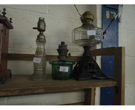 CAST IRON BASED CLEAR FONTED VICTORIAN LAMP, A FURTHER GREEN FONTED LAMP AND CLEAR BASED LAMP CONVERTED TO ELECTRICITY (3)   