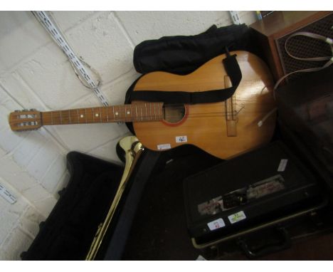 A FOUR-PIECE CLARINET AND ACOUSTIC GUITAR AND CASE (2)   