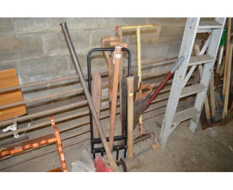 A bundle of long handled gardening tools etc.