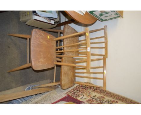 Three light Ercol stick back dining chairs