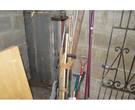 A quantity of gardening tools and a bundle of canes etc. 