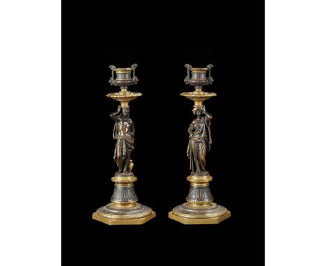 Bronzo dorato e patinato, raffiguranti figure all'antica su base esagonale. Marchiati e firmati "E. Jeannest fecit" sotto la 