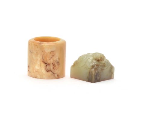 Y An unusual Chinese walrus ivory archer's ring, Qing Dynasty, 2.8cm high x 2.9cm diameter; and a square Chinese celadon jade