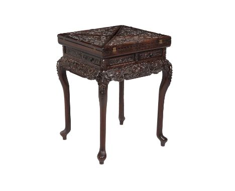 A Chinese hardwood envelope card table, late 19th century, folding top enclosing counter wells, above four frieze drawers, sh