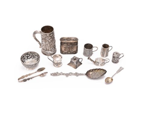 A collection of twelve Chinese export silver items, late 19th-early 20th century, comprising one silver mug, chased with flor