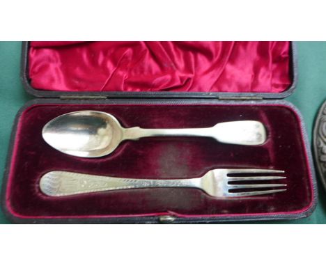 Silver backed toilet mirror (Birmingham 1908) with ornate Victorian plated handle and frame, boxed two piece plated fork and 
