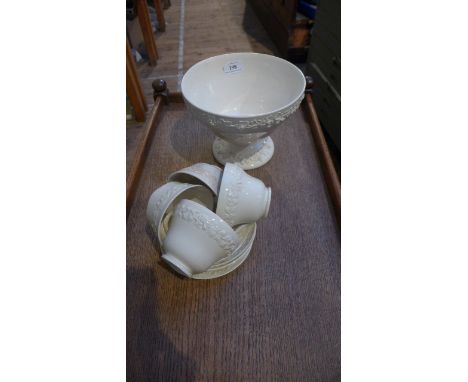 Wedgwood Cream ware Queens ware embossed decorative circular fruit bowl on circular plinth offered with 4 cups and saucers in