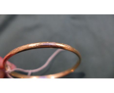 A gold slave bangle hallmarked 9ct (25 1/2gms)