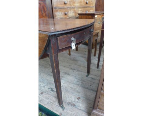 Georgian figured mahogany drop leaf sofa/small dining table on plain tapering legs on brass casters, inset 2 single drawers (