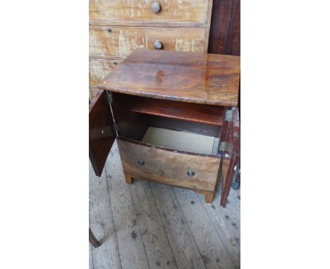 Figured mahogany commode style cabinet the lower fitted dummy drawer all with brass drop handles and finger plates 