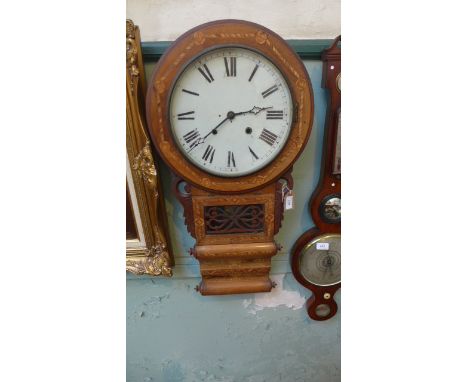 Inlaid wall clock in mixed woods, the ornate circular enamel dial painted roman numerals