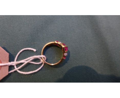 Ruby and diamond ring stamped 18ct. (.30ct diamond)