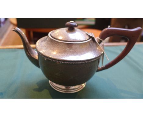 3 piece beaten silver tea service, the pot with bean handle to lid and brown bone handle (Birmingham 1927) (c. 23oz.)