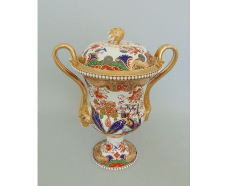 A Spode Vase and Pierced Cover with an Acorn finial. The gilt handles with goats heads. White beading to top and foot rims. I