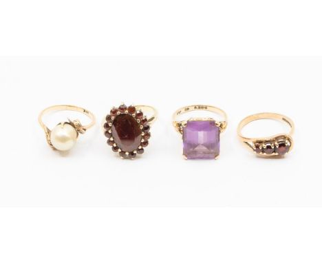 Four 9ct gold and stone set dress rings, comprising a rectangular cut amethyst approx 12 x 14mm, fancy shoulders, size N, a l