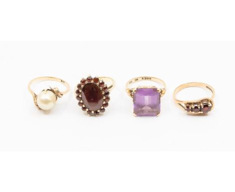 Four 9ct gold and stone set dress rings, comprising a rectangular cut amethyst approx 12 x 14mm, fancy shoulders, size N, a l