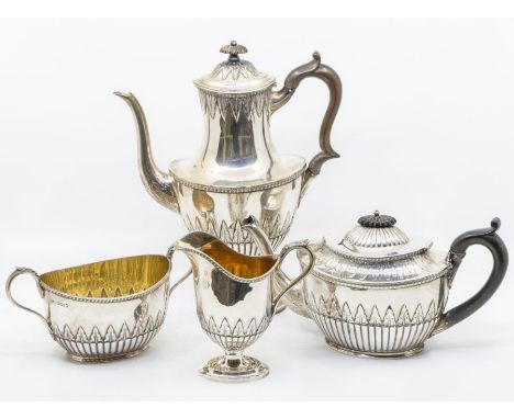 A matched Victorian silver four piece tea and coffee service, comprising coffee pot, teapot, helmet shaped milk jug and sugar