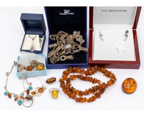 A collection of silver stone set jewellery to include amber pendants, rings, brooches, necklace, beads, single earrings, chai