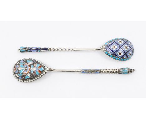 Two Russian style white metal and enamel teaspoons, both with twist detail to stem, both indistinctly marked on stems length 