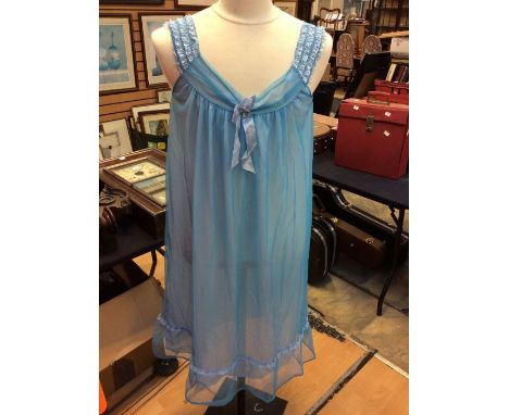 A collection of 1950/60's nightdresses to include; a blue nylon nightdress and a blue nylon bed jacket; a rose pink nightdres