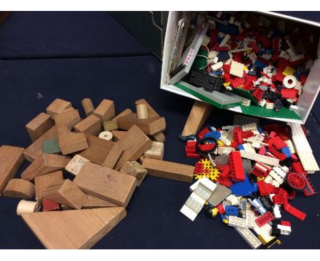 A collection of vintage Lego bricks, bases, wheels etc, along with wooden building bricks