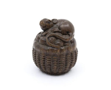 A Chinese carved hardwood netsuke, rat on fruit basket, mother-of-pearl inset signature, approx 4.5cm