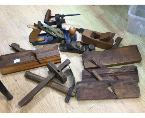 A collection of vintage wood work tools including planes etc
