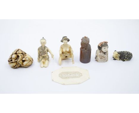 A Japanese erotic netsuke; a hardstone carved seal; an ivory cartouche pierced; small ivory okimono; resin okimono/metsuke