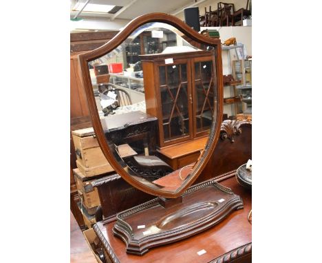 Late Georgian shield shaped toilet mirror, in mahogany with brass gallery rail around base, vanity well, but has Victorian be
