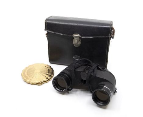 A vintage Kigu gilt metal floral shaped compact, fitted interior with mirror and stamped, with original pouch / dust cover to