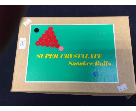 A boxed set of vintage super crystalate billiard balls