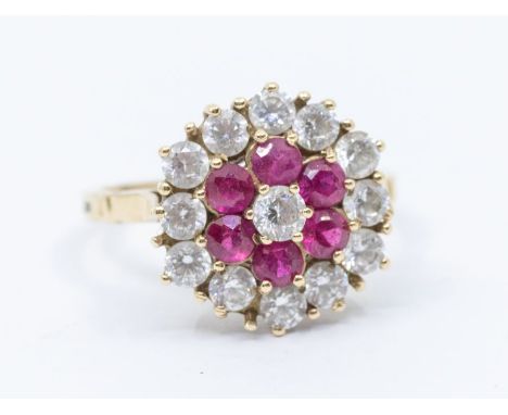 A ruby (probably synthetic) and colourless stone 9ct gold cluster, flower shaped setting, diameter approx 14mm, basket claw s