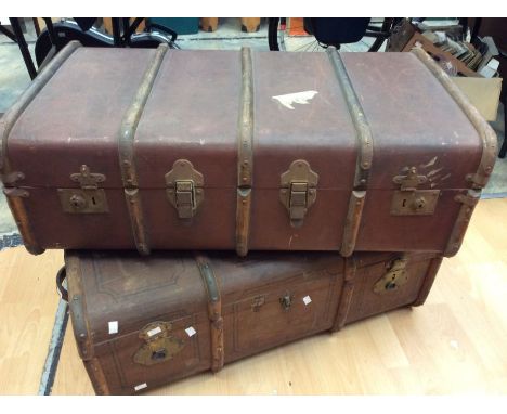 A pair of 1920's travel trunk with wooden strapping handle on either side