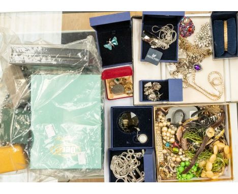 A collection of vintage and contemporary costume jewellery to include Swarovski pendants, crystals, together with unbranded p