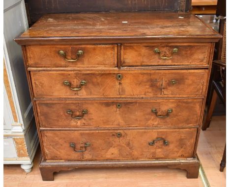 A George III walnut chest of two above three drawers, with brass swan neck handles, bracket feet bordered top, has slight kno