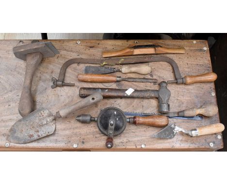 A collection of vintage wooden handled tools