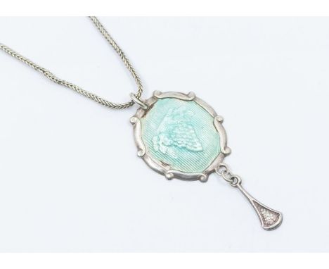 A Charles Horner silver and enamel pendant, comprising a turquoise enamel centre with raised grape decoration, suspending a s