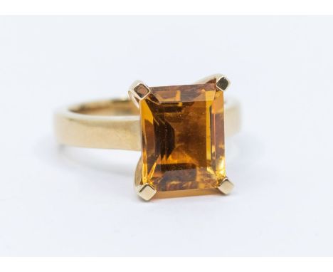 A citrine and 9ct gold dress ring, comprising a rectangular cut citrine, approx 8 x 11mm, to  flat band, size N1/2, total gro