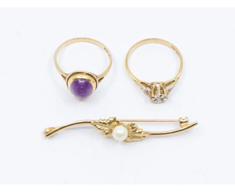 A diamond and 9ct gold ring, size N, along with a 9ct gold and amethyst cabochon set ring (stone abraded) size N, together wi