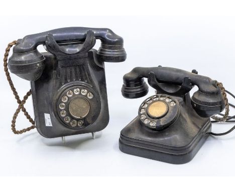 Two vintage 1920/30s black telephones, numbered to back, one wall mounted