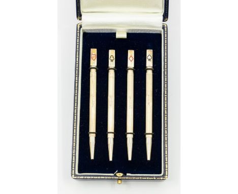 A set of four sterling silver propelling Bridge pencils, each with block terminal engraved with one of the four playing card 