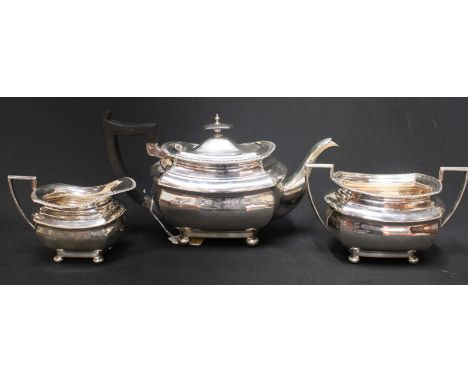 A George V Walker & Hall silver three piece tea set, hallmarked Sheffield 1913, comprising teapot, milk jug and sugar bowl, w