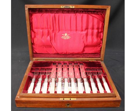 A set of twelve-each Victorian silver-plated and mother of pearl dessert knives and forks in a mahogany case.