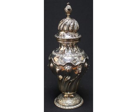 A Victorian silver repousse sugar caster, hallmarked Sheffield 1897, with writhen fluted lip and pineapple finial, the body w