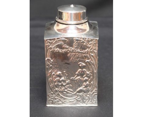A Victorian silver repousse tea caddy and cover, hallmarked London 1898. The sides decorated in relief with figures in landsc