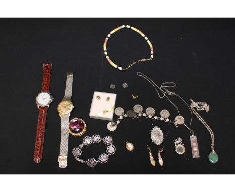 A mixed lot of assorted jewellery including two watches, a silver ingot, brooch, earrings, bracelets, silver and jade necklac