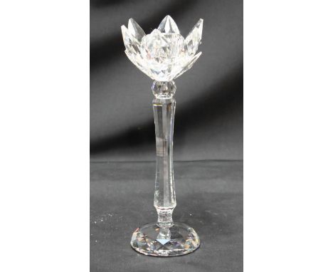 A Swarovski cut crystal candlestick, in original foam packaging and cylindrical box, 19.5 cm high.
