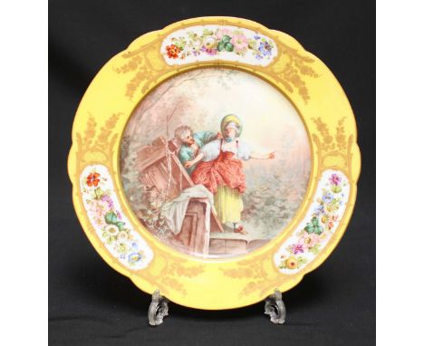 A 19th century Sevres porcelain cabinet plate, the centre painted with a Watteau 'style' scene of a man leading a blindfolded