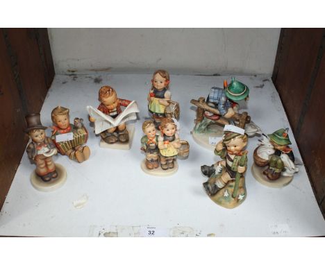 SECTION 32. A collection of eight Goebel and Hummel figures.